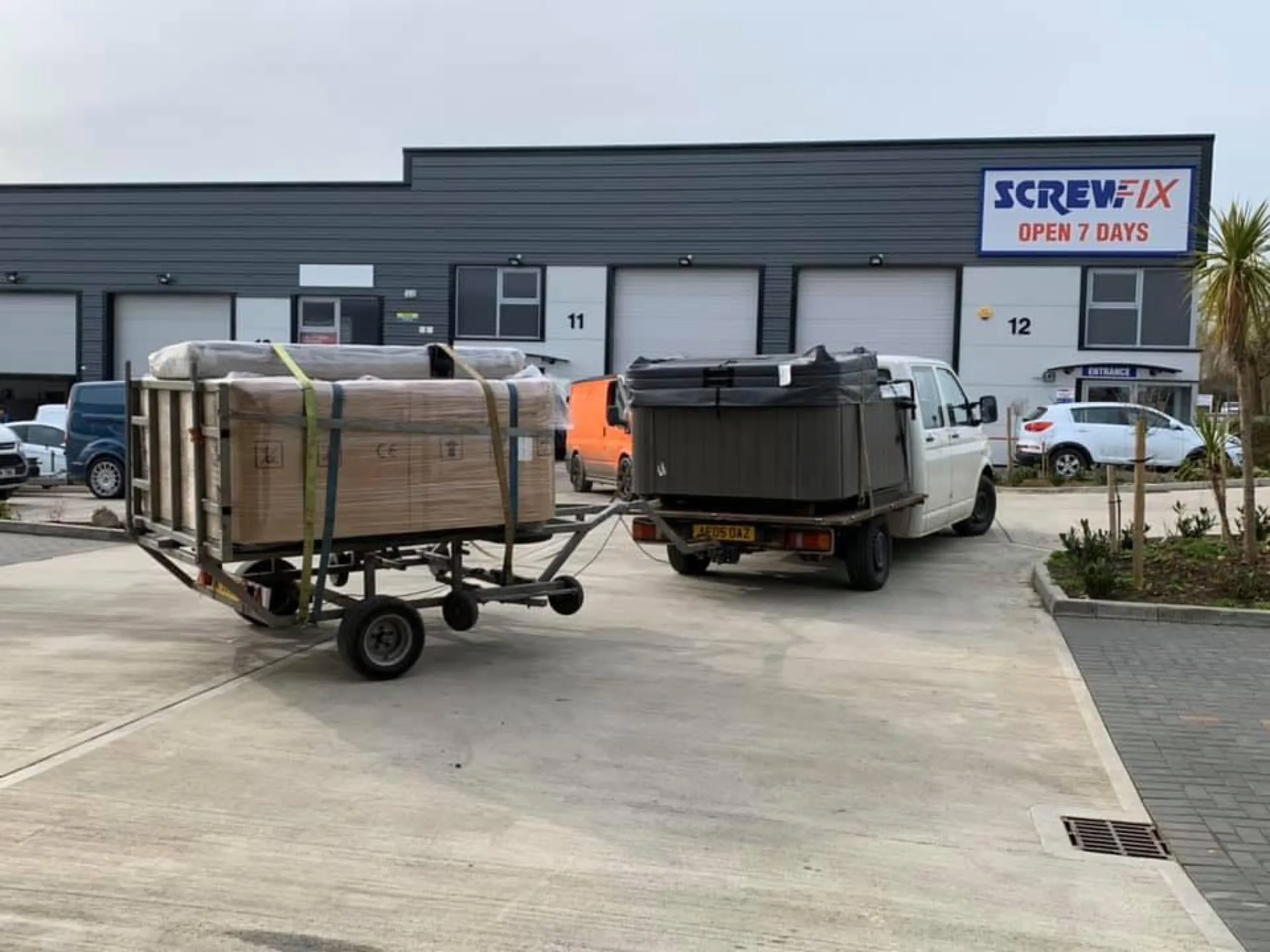Hot tubs loaded on specialist trailer at depot